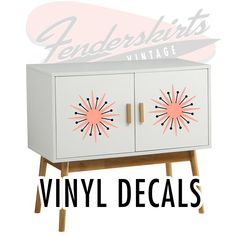 a white cabinet with pink sunburst decals on the front and side panels