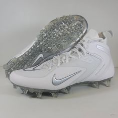 a pair of white and silver nike shoes