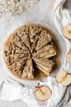 an apple pie with slices cut out on a plate