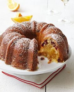 a bundt cake on a plate with one slice cut out