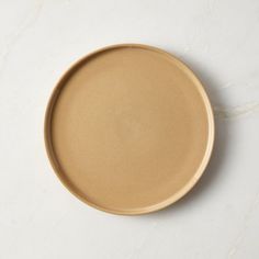 a brown plate sitting on top of a white counter