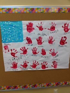 a bulletin board with handprints on it