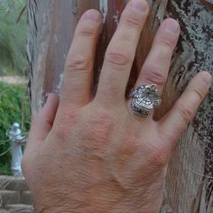 This beautifully detailed 3D saddle ring is artfully made with 925 sterling silver. A must-have for any cowboy or cowgirl who loves the wild spirit of the American southwest! Give the perfect gift to that special someone who cherishes horses and embraces the western way of life. Size 10 This ring can be sized up or down within two sizes for an additional fee. Contact me with questions. Measures About: 1" x 15/16" Weight: 16 Grams Signed: SC Stamped: Sterling Western Style 925 Silver Rings As Gifts, Western Style Sterling Silver Rings In Silver, Western Style Sterling Silver Rings, Handmade Silver Western Style Rings, Western Style Untreated Sterling Silver Rings, Handmade Western Silver Rings, Western Style Stamped 925 Rings As Gift, Western Sterling Silver Gemstone Ring, Western Style Silver Horseshoe Jewelry