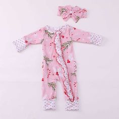 This is an adorable  footies romper made from soft bamboo fabric.  This type fabric is the new and comfy feel for newborns. This is a light weight fabric but super soft for babies Listing includes * footies  * headband is sold separately due to limited fabric supply * double zipper (this is an amazing feature you will love when changing) Romper has cuffs that fold over the hands and feet Super cute for Santa pictures Pink Onesie For Winter Pajama Party, Cute Pink Sleepwear For Holiday, Playful Pink Onesie As A Gift, Playful Pink Onesie As Gift, Playful Pink Long Sleeve Jumpsuits And Rompers, Playful Long Sleeve Pink Jumpsuits And Rompers, Pink Cotton Onesie For Gift, Pink Cotton Onesie As A Gift, Pink Cotton Onesie As Gift