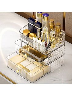 a clear container filled with cosmetics on top of a counter