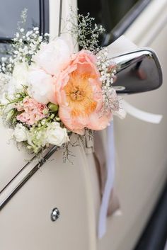 a car decorated with flowers and baby's breath