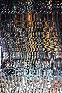 an abstract image of wavy lines and colors