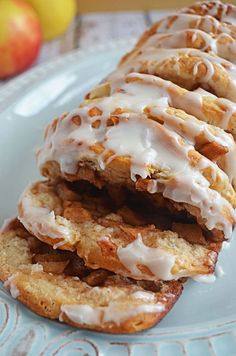 there are many donuts on the plate and one is drizzled with icing