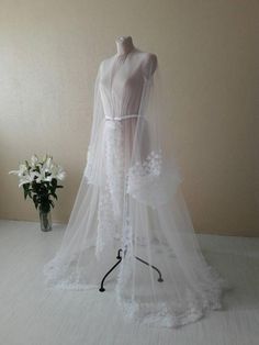 Check out this item in my Etsy shop https://www.etsy.com/listing/724418166/couture-dress-white-boudoir-dress-desing Ethereal Wedding Gown With Sheer Bodice, Ethereal Organza Wedding Gown, White Tulle Gown With Long Train, Wedding Night Gown With Detachable Tulle Train, Sheer Tulle Wedding Dress For Bride, Ethereal Tulle Wedding Gown, Tulle Gown With Detachable Train For Wedding Night, Ethereal White Floor-length Gown, Ethereal Sheer Tulle Gown