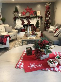 a living room filled with furniture and christmas decorations