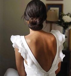 the back of a woman in a white dress