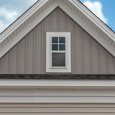 an image of a house with a cat on the roof