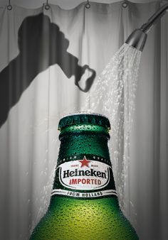 a bottle of heineken is being sprayed with water