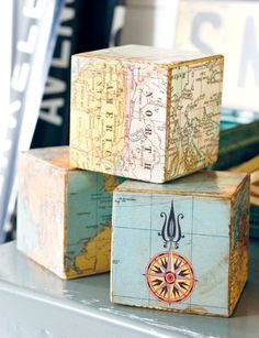 three wooden boxes sitting on top of a table