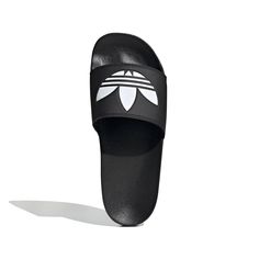 Style No. FU8298 Color: Core Black / Cloud White / Core Black Full-time vacation vibes. These Adilette Lite Slides free your feet. (Or wear them with socks, no judgment here.) This pair features a super-soft footbed for an instantly comfy feel. There's an adidas Trefoil on top so you can feel sporty, even when you're lounging. Slip-on Synthetic bandage upper Super-soft feel Cushioned sporty slides Synthetic outsole Sport Slippers, Vinyl Bag, Black Slides, Adidas Adilette, Adidas Trefoil, Slides Shoes, Helly Hansen, Mens Vans, Black & White