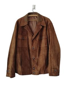 Vintage Classic Suede Leather Mens Jacket, Brown Outerwear Botton Jacket , Suede Jacket ,one side pocket on the right and left, one breast pocket with button on the right and left size L-XL  Chest: 127 cm/ 50 in Lenght: 76 cm/ 30 in  Sleeve lenght: 65 cm/ 26 in Sholders (back): 54 cm/ 21 in Materials: suede leather Condition: very good vintage condition Defects:there are 2 small spots, one is on the elbow of the left sleeve and the other is on the waistband on the lower back, they are shown in t Brown Leather Jacket With Patch Pockets, Brown Long Sleeve Biker Jacket With Flap Pockets, Retro Brown Biker Jacket With Pockets, Retro Brown Outerwear With Pockets, Vintage Winter Biker Jacket With Flap Pockets, Vintage Biker Jacket With Flap Pockets For Winter, Retro Brown Utility Jacket With Pockets, Brown Retro Utility Jacket With Pockets, Retro Long Sleeve Leather Jacket For Outdoor