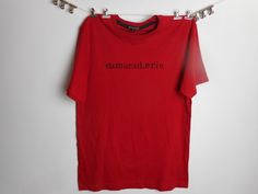 Camaraderie Logo Vintage Crew Neck Cotton T-Shirt  FREE SHIPPING Size - Small - to fit chest - 36 - 38in - 91 - 96CM  This is a plain red tee that i have hand screen printed an image using black waterbased ink -  My methods are very analogue, i cut out the words from a old book stick them together and then photocopy to the size i want -                                                camaraderie is the word and its french for fellowship and fellowship is life  Thanks for looking Hipster Bike, Plain Red, Vintage Cherry, Womens Knit Tops, Hipster Shirts, Logo Vintage, Red Tee, Valentine T Shirts, Red T Shirt