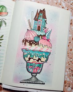 an open book with a drawing of a cupcake on it's front cover