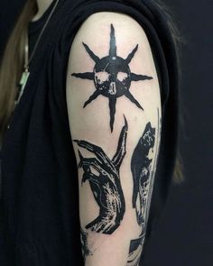 a person with a black and white tattoo on their arm