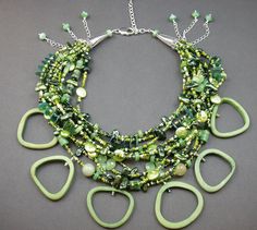 "Mary Heuer makes one of a kind jewelry in her studio in Wisconsin. This gorgeous dramatic statement necklace contains so many elements its hard to name them.  Includes bone, agate, chrysophrase, freshwater pearls, glass, sterling silver cones and lobster clasp.  It is slightly adjustable from approximately 17-19 inches and green bone elements hang down about 1.25-1.5 inches from the bulk of the necklace.  It is truly stunning.  Originally priced at $150, it has now been reduced to $135. All of my one of a kind necklaces and bracelets are shipped USPS Priority Mail within 1-5 days after receipt of payment.  Measurements are approximate as all items are handmade and may vary slightly in size.   Please see my article titled \" Copper Drama\" in the summer 2014 issue of Belle Armoire Jewelry, In Her Studio, Stone Sculpture, Wedding Jewellery Necklace, Multi Strand Necklace, Summer 2014, Unique Necklaces, Multi Strand, Wedding Necklace, Priority Mail