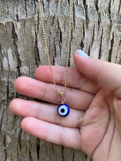 "This necklace is combination of -Handmade Blue Evil Glass bead. -18\" Gold Filled Chain . 🧿The evil eye is a curse or legend believed to be cast by a malevolent glare, usually given to a person when they are unaware. ... Talismans or amulets created to protect against the evil eye are also frequently called \"evil eyes\".🧿" Blue Beaded Chain Spiritual Necklace, Blue Spiritual Beaded Chain Necklace, Blue Beaded Chain Necklace With Spiritual Style, Blue Beaded Charm Necklaces With Round Beads, Blue Tiny Beads Necklace For Gifts, Blue Tiny Beads Necklace For Gift, Blue Necklaces With Tiny Beads For Gifts, Blue Beaded Necklaces With Adjustable Chain, Blue Necklaces With Tiny Beads As Gift