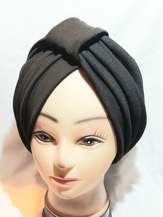 This beautiful turban is made from stretchy scuba fabric, to make you look so gorgeous when you use it irrespective of the reason of using it. It is carefully crafted with love to Light up your day. it is designed with comfort and style in mind, it is easy to wear, no tying hassle, just wear on your head, and you are ready to go. This pre-tied turban is versatile, compliments every outfit, and is a perfect choice for dressing up or party. In addition, it could be an alternative to wigs for people who experiencing alopecia. it is comfortable and affordable. Style: classy Size: Stretchy fabric one size fit all Care: hand wash with mild detergent and air dry. Thanks for stopping byat my shop. Fitted Black Turban For Summer, Fitted Black Summer Turban, One Size Black Turban For Party, Adjustable Winter Turban, Black Fitted Turban For Party, One Size Black Headwrap For Party, Trendy Black Turban One Size Fits Most, Trendy Black Turban, Fitted Turban