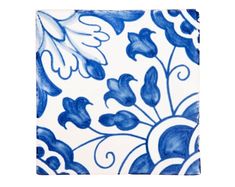 a blue and white tile with flowers on it