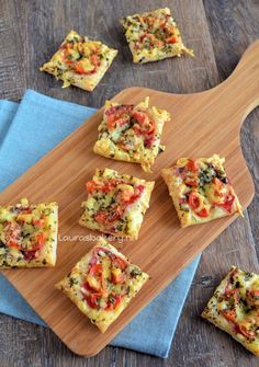 small square pizzas on a wooden cutting board