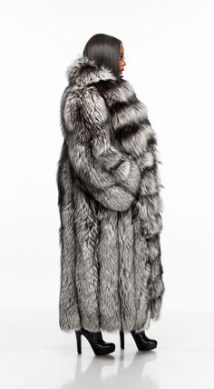 Now this is a coat! Our stunning Fancy full length coat with detachable sleeves is made of the highest quality full skin silver fox fur. Zip off the fabulous sleeves to sport a Fancy vest. This coat features hook closure and pockets. The Fancy coats runs large. Please order one size down from your normal size. Model is 5'5'', 160lbs, 36G bust, 29 inch waist, 43" hips and is wearing a size M. Big Fur Coat, Snow Tiger, Fabulous Fox, Fox Coat, Girls Fur, Full Length Coat, Fabulous Furs, Fur Hood Coat, Fur Coats Women