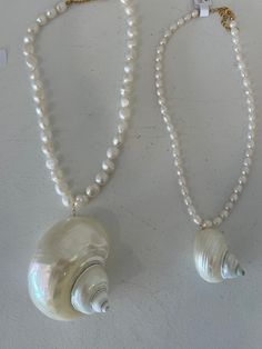 Turbo shell necklaces. Order one on a dainty av chain or email us to make a custom one with fun beads. Luxury Handmade Elegant Shell Necklace, Cheap Shell Necklaces With Round Beads, Luxury Beaded Shell Necklace As Gift, Cheap Silver Shell Necklace, Big Shell Necklace, Hawaii Crafts, Big Pearl Necklace, Big Shell, Shell Jewellery