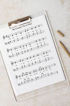 a clipboard with sheet music on it