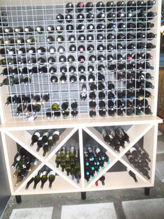 a wine rack filled with lots of bottles