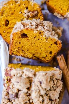 slices of pumpkin bread on a tray with cinnamon sticks