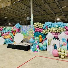 an indoor event with balloons and decorations