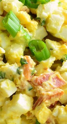 scrambled eggs with green onions and bacon in a bowl, ready to be eaten for lunch