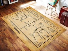 a basketball court rug is shown on the floor in front of a chair and bookshelf