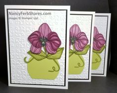 three cards with pink flowers in a green vase