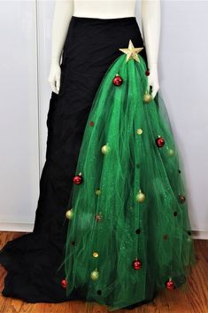 a green tulle skirt with red and gold ornaments on the bottom, along with a star