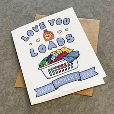 a father's day card with an image of clothes in a laundry basket and the words love you loads on it