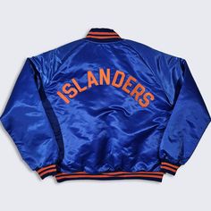 New York Islanders Vintage 80s Pyramid Satin Bomber Jacket  NHL Hockey Blue & Orange Coat White Quilted Lining  Made in USA In Excellent Vintage Condition No Holes or Stains Size Men's : Extra Large ( XL ) PLEASE CHECK YOUR MEASUREMENTS Measurements: Length: 25 in Pit to pit: 25 in FREE AND FAST SHIPPING IN THE USA Orange Coat, Coat White, New York Islanders, White Quilt, Nhl Hockey, Blue Orange, Nhl, Made In Usa, Extra Large