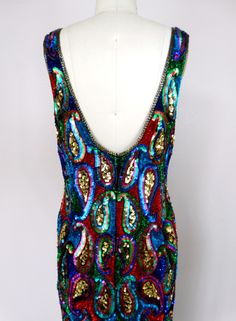 "This fun vintage party dress is fully embellished with colorful sequins and in perfect condition! Measurements: Bust - 36\" Waist - 30\" Hips - 38\" Length - 37\" Tag Size - Medium This dress comes from a pet-free and smoke-free home. If you would like more info or have any questions, please don't hesitate to ask!" Disco Style Sequined Dresses For Festivals, Disco Style Sequined Festival Dresses, Fitted Sequin Dress For Festival, Fitted Embellished Festival Dress, Multicolor Festival Dresses For Party, Glamorous Multicolor Sequin Dress For Festive Occasion, Multicolor Festival Dress For Party Season, Fitted Sleeveless Sequin Dress For Festivals, Sleeveless Sequin Festival Dresses