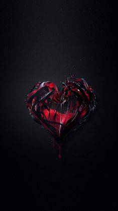 a heart shaped object with blood dripping from it's sides on a black background