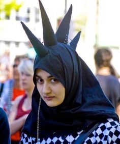 two women dressed in costumes talking to each other with caption that reads, it's hard to muslim and punk