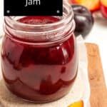 a jar filled with fruit sitting on top of a cutting board