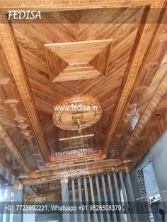 the inside of a building with wooden ceilings