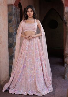 Item: Lehenga Set ( Lehenga Skirt, Blouse and Dupatta) Embrace whimsical elegance with our Rose Quartz Designer Lehenga, where tradition meets modernity in a magical dance of beauty and grace. Handcrafted by our artisans with meticulous attention to detail, this ensemble is a true work of art. With our Made-to-order wedding lehenga, customize your ensemble and let your imagination run wild as you create the wedding of your dreams. The soft shades of pink, combined with the playful and vibrant sequence and pearl work making this bridal lehenga, an absolute show stopper.  Our bespoke lehengas are designed with a can-can lining beneath the skirt to ensure a voluminous silhouette that enhances your twirls and captures stunning photographs. At Vivah by Shobitam, our utmost desire is to curate a Special Occasion Gowns, Lehenga Designs Simple, Skirt Blouse, Lehenga Skirt, Pink Lehenga, Indian Lehenga, Designer Lehenga, Wedding Lehenga