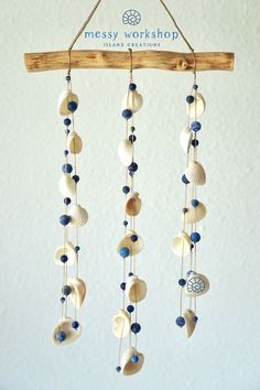 a wind chime with seashells hanging from it