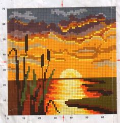 a cross stitch pattern with the sun setting over water and mountains in the distance, as well as clouds