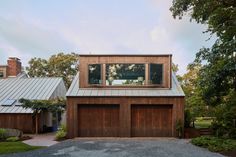 two garages on the side of a house