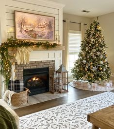 a living room with a christmas tree in the corner and other decorations on the fireplace mantel